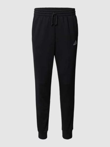 ADIDAS SPORTSWEAR Sweatpants mit Logo-Streifen in Black, Größe S