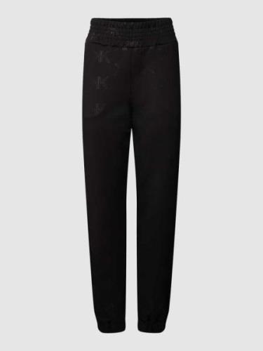 Kendall & Kylie Sweatpants mit Allover-Logo Modell 'EMBOSSED' in Black...