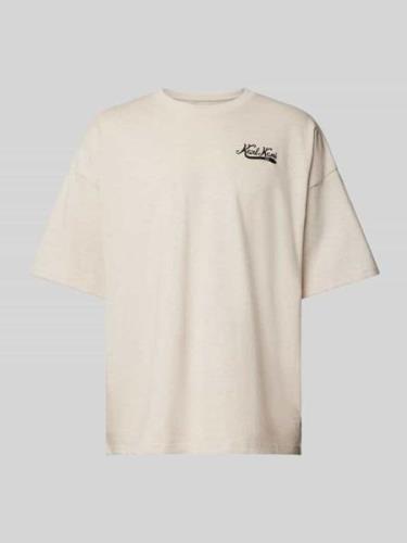 KARL KANI Oversized T-Shirt mit Label-Schriftzug in Beige, Größe XS