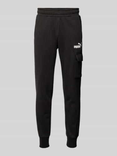 PUMA PERFORMANCE Slim Fit Sweatpants mit Cargotasche in Black, Größe X...