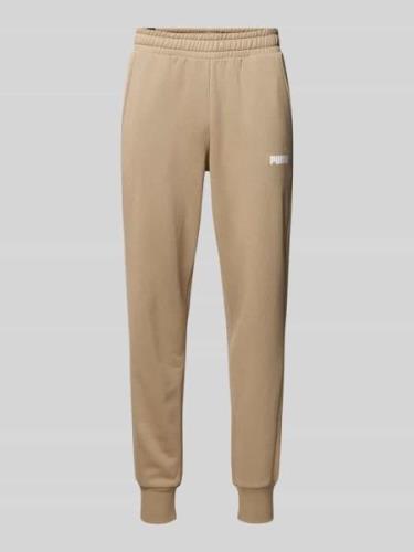 PUMA PERFORMANCE Regular Fit Sweatpants mit Label-Print in Beige, Größ...