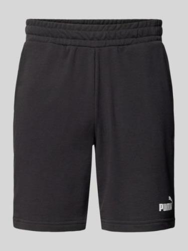 PUMA PERFORMANCE Regular Fit Sweatshorts mit Label-Print in Black, Grö...