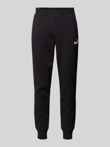 PUMA PERFORMANCE Relaxed Fit Sweatpants mit Label-Print in Black, Größ...