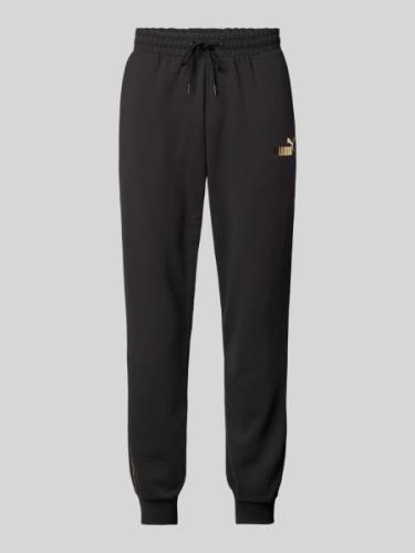 PUMA PERFORMANCE Relaxed Fit Sweatpants mit Label-Print in Black, Größ...