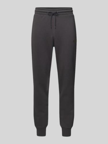 PUMA PERFORMANCE Tapered Fit Sweatpants mit Label-Print in Black, Größ...