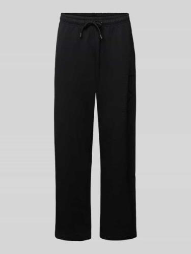 EA7 Emporio Armani Baggy Fit Sweatpants mit Label-Print in Black, Größ...