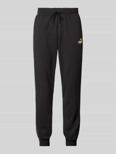 PUMA PERFORMANCE Relaxed Fit Sweatpants mit Label-Print in Black, Größ...