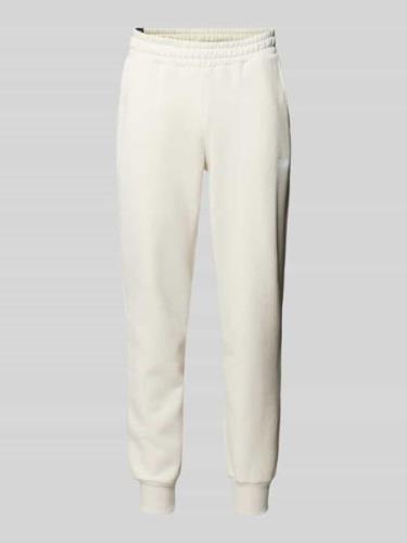 PUMA PERFORMANCE Relaxed Fit Sweatpants mit Label-Print in Offwhite, G...