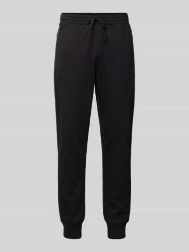 CHAMPION Relaxed Fit Sweatpants mit Reißverschlusstaschen in Black, Gr...