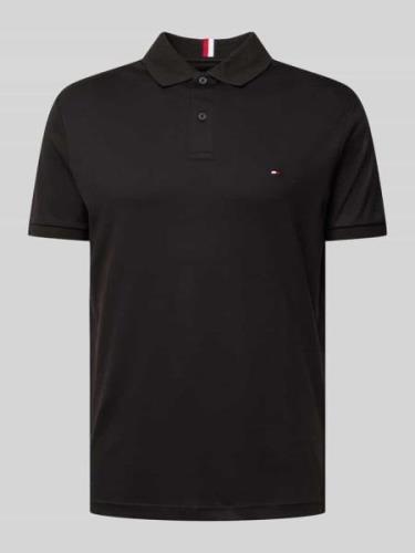 Tommy Hilfiger Slim Fit Poloshirt mit Logo-Stitching in Black, Größe L