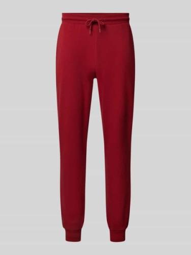 Tommy Hilfiger Sweatpants mit seitlichen Eingrifftaschen in Rot, Größe...