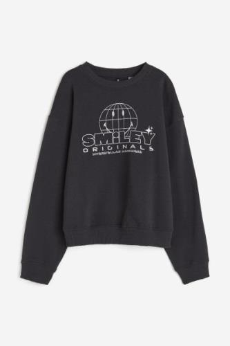H&M Sweatshirt mit Print Dunkelgrau/Smiley®, Sweatshirts in Größe XS. ...