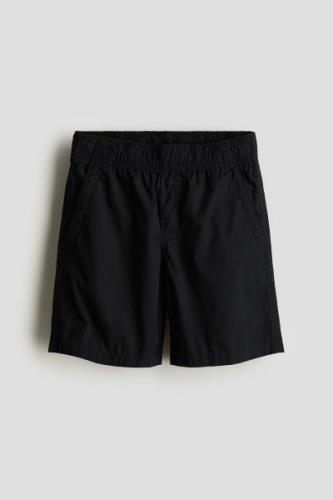 H&M Schlupfshorts aus Baumwolle Schwarz in Größe 146. Farbe: Black