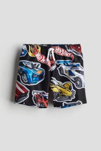 H&M Badeshorts mit Print Schwarz/Hot Wheels in Größe 134/140. Farbe: B...