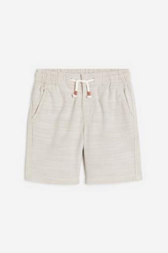 H&M Chino-Shorts Loose Fit Hellbeige in Größe 140. Farbe: Light beige