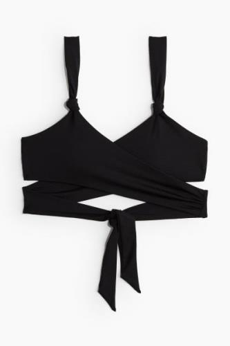 H&M Wattiertes Wickel-Bikinitop Schwarz, Bikini-Oberteil in Größe 32. ...