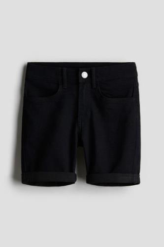 H&M Jeansshorts Slim Fit Schwarz in Größe 158. Farbe: Black 020