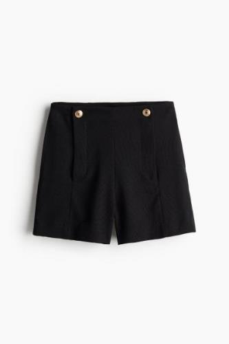 H&M Shorts mit Zierknöpfen Schwarz in Größe 34. Farbe: Black