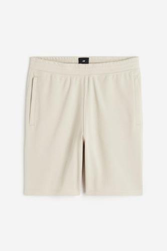 H&M COOLMAX® Shorts Hellbeige in Größe XS. Farbe: Light beige