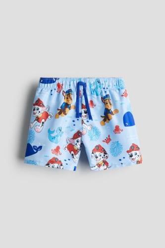 H&M Badeshorts mit Print Hellblau/PAW Patrol in Größe 134/140. Farbe: ...