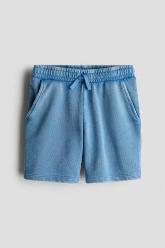 H&M Sweatshorts Ausgewaschenes Blau in Größe 140. Farbe: Washed blue